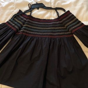 black puffy top. with multicolor chevron design